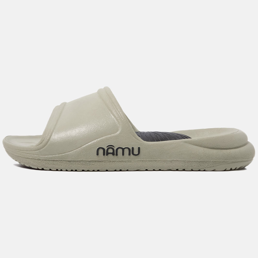 Beige slide sandal with 'namu' branding on a white background