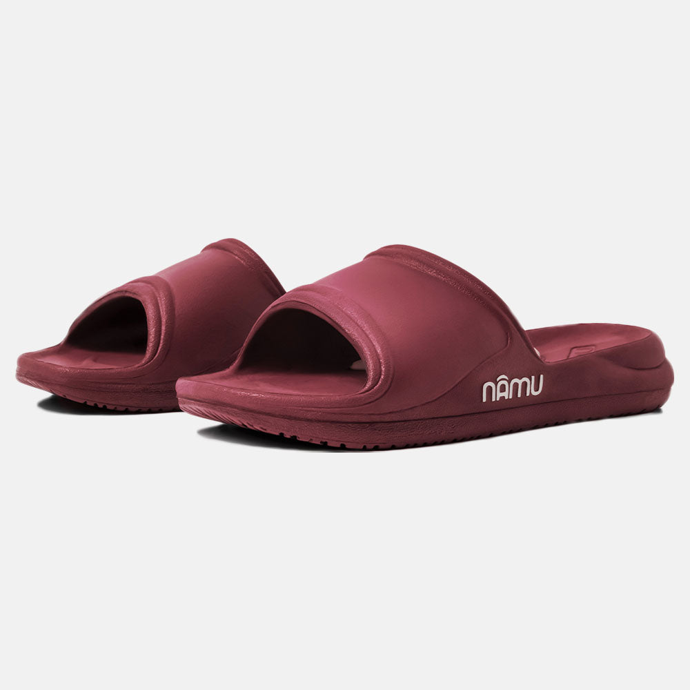 Pair of maroon slides with 'namu' branding on a white background