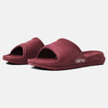 Pair of maroon slides with 'namu' branding on a white background
