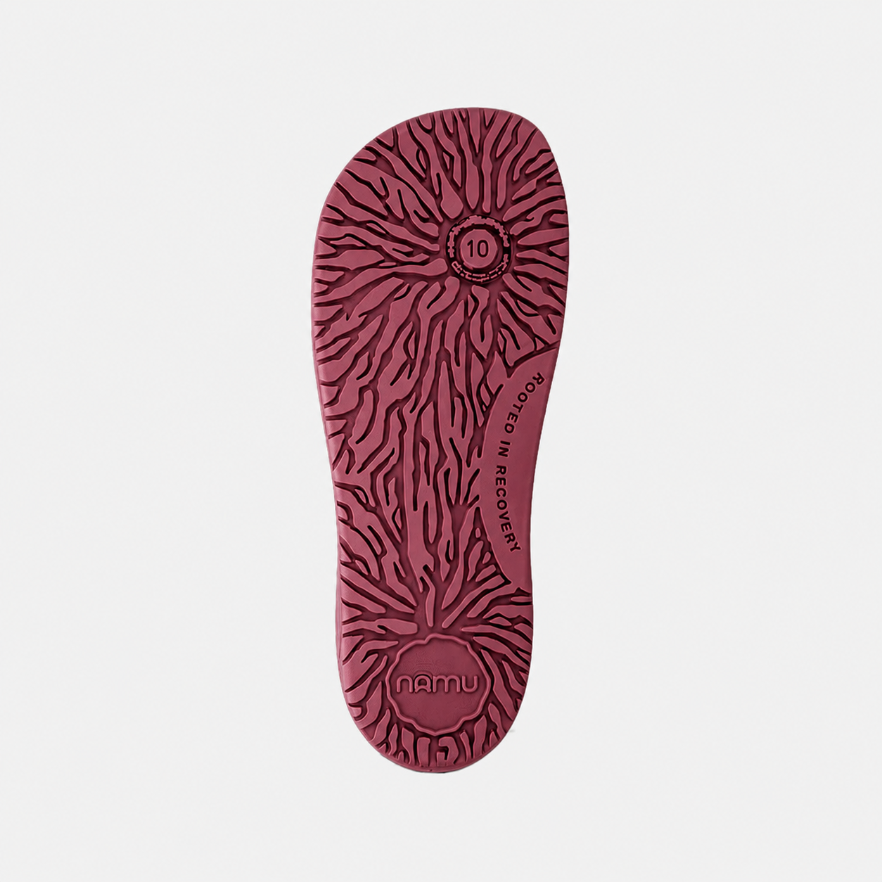 Red shoe sole with pattern and 'namu' branding on a light gray background